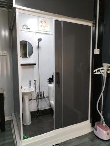 a bathroom with a shower and a toilet at The Vanilla Cabin 2 in Kuala Terengganu +29 photos