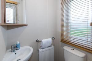 Koupelna v ubytování Lodge No 55 - Stewart's Resort Cameron + 6 fotografií