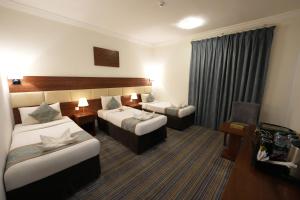 Voodi või voodid majutusasutuse Snood Al Rayan Hotel toas