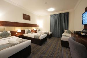 Voodi või voodid majutusasutuse Snood Al Rayan Hotel toas