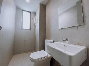 a white bathroom with a sink and a toilet at Cozy Kenwingston Platz KL 2-5 Pax 2BR & 2BR FrePakin Netflix 2802 in Kuala Lumpur +26 photos