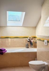 a bathroom with a tub and a toilet at Dworek nad Wisłą in Wisła +29 photos