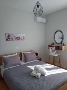 A bed or beds in a room at Marianna's room