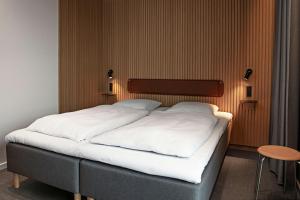 Rúm í herbergi á Four Points Flex by Sheraton Horsens