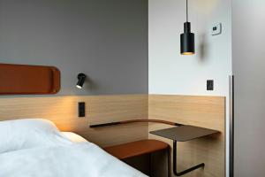 Rúm í herbergi á Four Points Flex by Sheraton Horsens