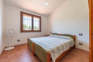 Ένα ή περισσότερα κρεβάτια σε δωμάτιο στο Casa Giuliana