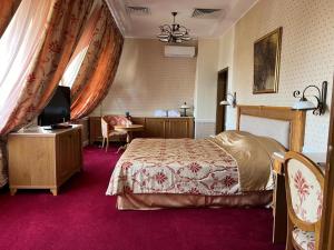 Postel nebo postele na pokoji v ubytování Danube Hotel & Spa
