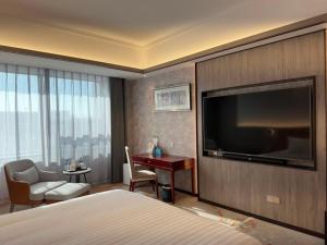 TV o dispositivi per l'intrattenimento presso Beijing Jingyi Hotel