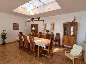 a dining room with a table and chairs at Casa La Vista in Canillas de Albaida