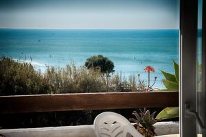 a view of the ocean from a balcony at Villas Flamenco Beach Conil in Conil de la Frontera