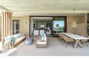 a living room with a couch and a table at LO- Los Olivos Benahavis by Roomservices in Benahavís