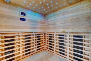 a sauna with wood paneling and lights on the ceiling at Pieron & Bavigo Villas - Spa Oasis in Marčana