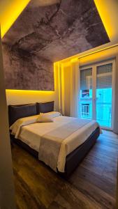 a bedroom with a large bed in a room at Case Vacanze 106 Maison De Charme in Giovinazzo