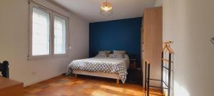 Postel nebo postele na pokoji v ubytování La Bonne Etoile - Chambres d'hôtes et Appartements -