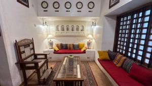 a living room with a couch and a table at Beytsalam in Lamu