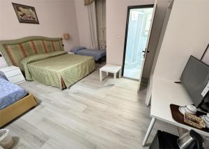 Postel nebo postele na pokoji v ubytování Hotel Ely + 13 fotografií