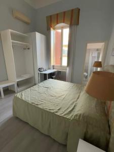 Postel nebo postele na pokoji v ubytování Hotel Ely