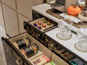 a drawer in a cabinet filled with food and drinks at Marina Bay Sands in Singapore