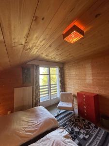 Letto o letti in una camera di Cache-Cache MOUNTAIN & QUIET chalet 10 pers