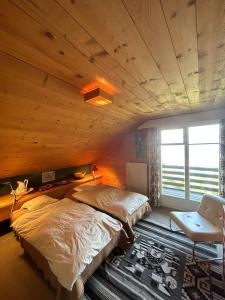 Letto o letti in una camera di Cache-Cache MOUNTAIN & QUIET chalet 10 pers