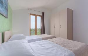 Łóżko lub łóżka w pokoju w obiekcie Villa Santa Lucia - Istrian Oasis