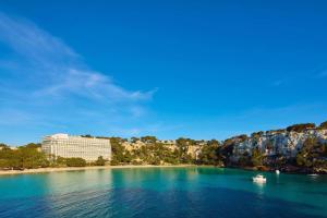 a view of a resort from the water at Meliá Cala Galdana in Cala Galdana