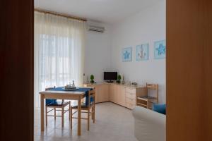 a kitchen and dining room with a table and chairs at Naumachia 46 - YourPlace Abruzzo in Vasto