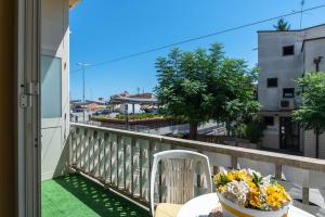a balcony with a table and chairs and a view at Naumachia 46 - YourPlace Abruzzo in Vasto