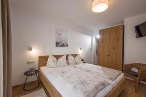 Postel nebo postele na pokoji v ubytování Haus Edelweiss