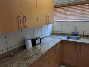 Kuchyň nebo kuchyňský kout v ubytování Jakkalsdraai Guest House