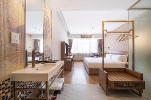 Voodi või voodid majutusasutuse Xicheng International Hotel Guangzhou Sanyuanli Jiangxia Metro Station Branch toas