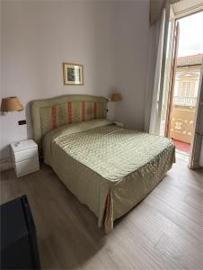 Postel nebo postele na pokoji v ubytování Hotel Ely