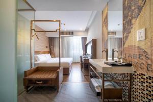 Voodi või voodid majutusasutuse Xicheng International Hotel Guangzhou Sanyuanli Jiangxia Metro Station Branch toas