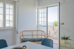 a dining room with a view of the ocean at Ferrante - YourPlace Abruzzo in Fossacesia