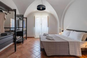 a bedroom with a bed and a dresser at Villa Carulli - YourPlace Abruzzo in Villa Caldari