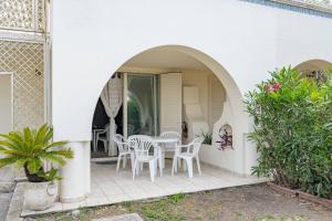 a patio with a table and chairs in a house at Villa Claudia - YourPlace Abruzzo in Casalbordino