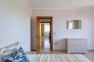 Ένα ή περισσότερα κρεβάτια σε δωμάτιο στο La Rocchetta