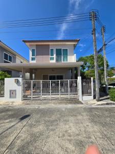 a house with a white fence in front of it at MB Home in Ban Bang Khu