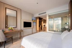 TV a/nebo společenská místnost v ubytování Panorama Wins Residences Nha Trang