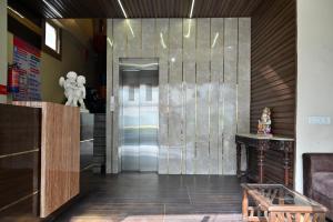 a lobby with a metal elevator in a room at Hotel Hari Gopal in Varanasi