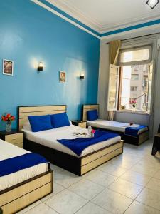 Postel nebo postele na pokoji v ubytování Hostgram Hotel