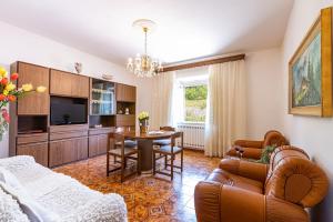 a living room with a couch and a table at Casa Damiano in Chianni