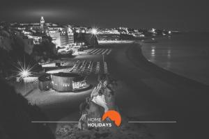 a black and white photo of a city at night at #258 Travessa do Mar F by Home Holidays in Albufeira +19 photos