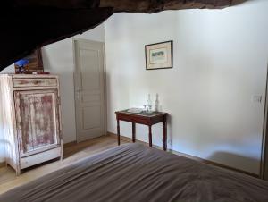 Łóżko lub łóżka w pokoju w obiekcie Un Jardin Secret