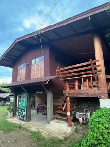 a small building with a staircase in front of it at Thai Wooden Garden House By Paddy Fields Haven - Natures Nest in Pai