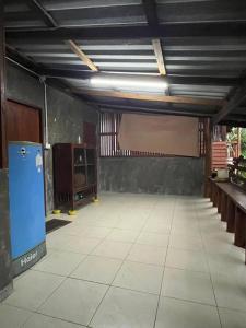 a large empty room with a projection screen in it at Thai Wooden Garden House By Paddy Fields Haven - Natures Nest in Pai