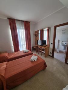 Postel nebo postele na pokoji v ubytování Aba Hotel