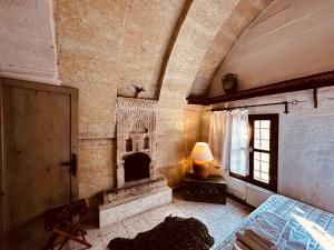 A bed or beds in a room at Les Maisons De Cappadoce