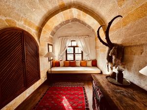 A bed or beds in a room at Les Maisons De Cappadoce