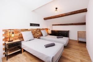 En eller flere senge i et værelse på Duplex Factory II Hyper Centre